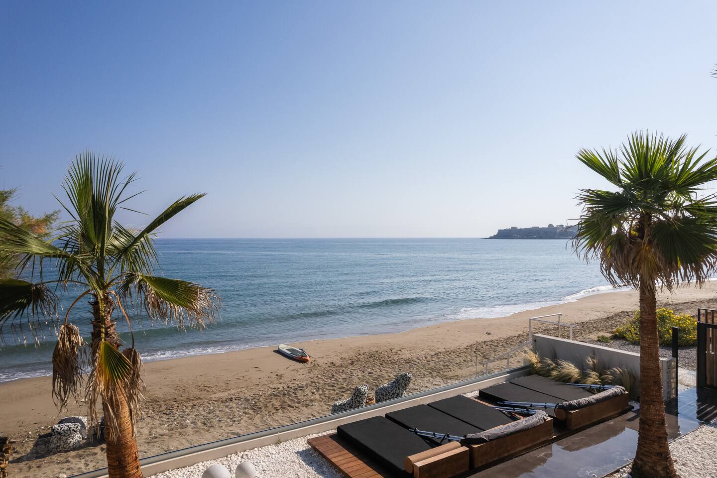 Casa Negro terrace and deck with the beach and sea beyond