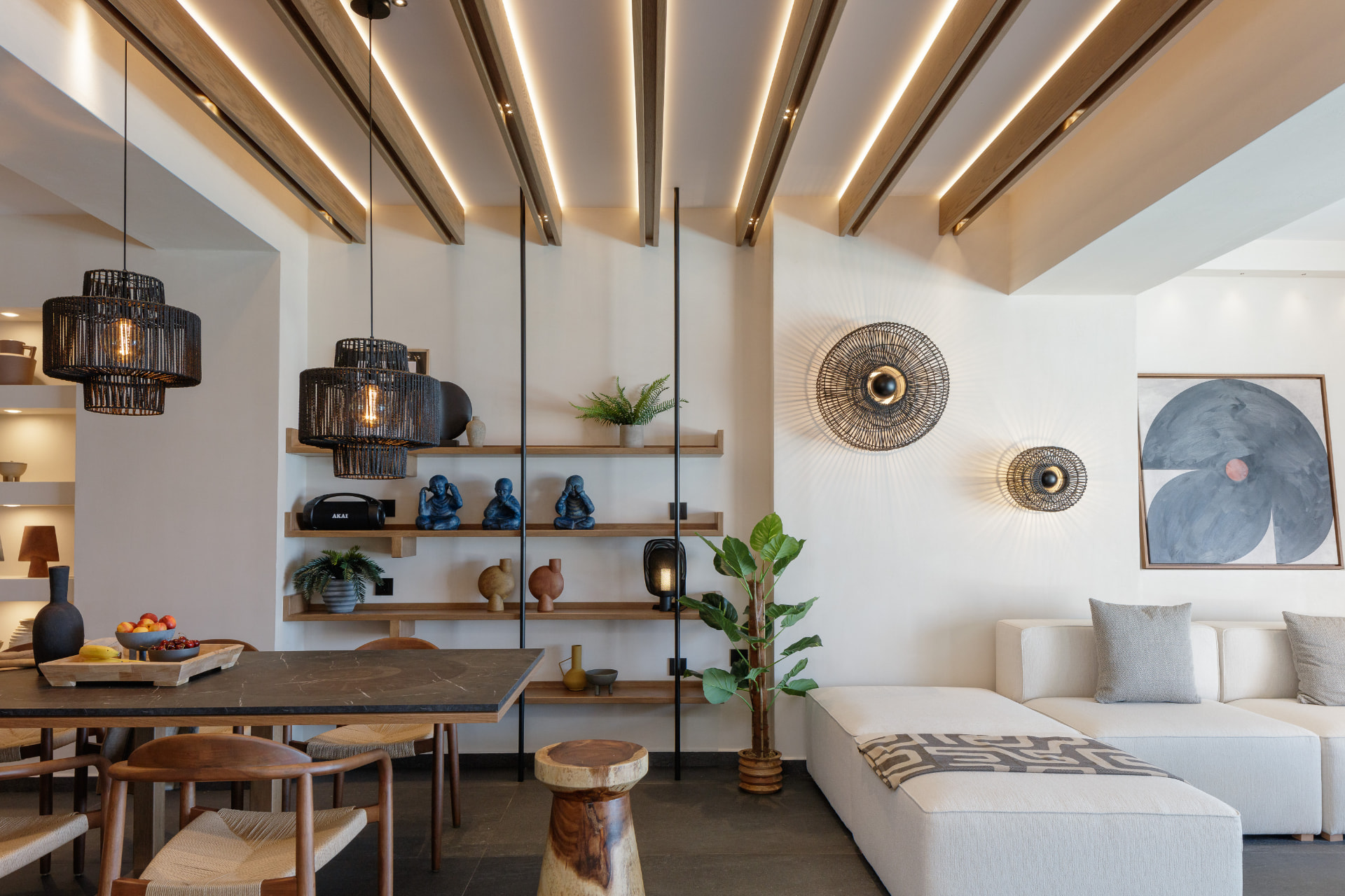 Dining area with woven pendants and open shelving