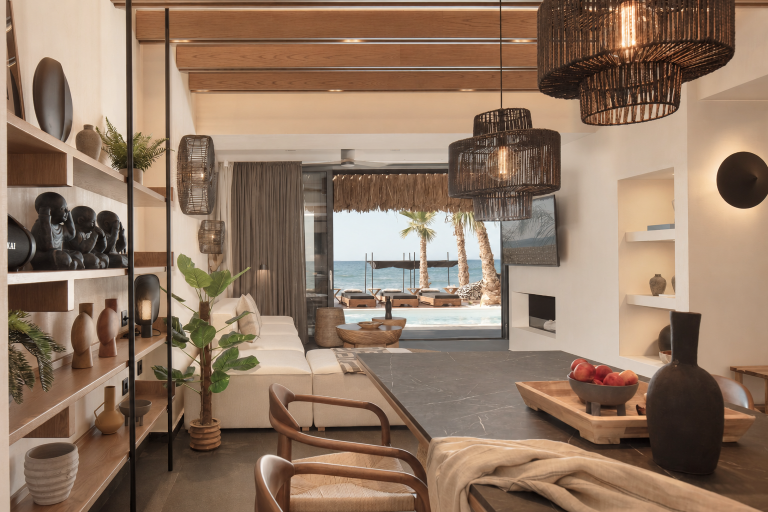 Open-plan living and dining area opening onto the pool and sea